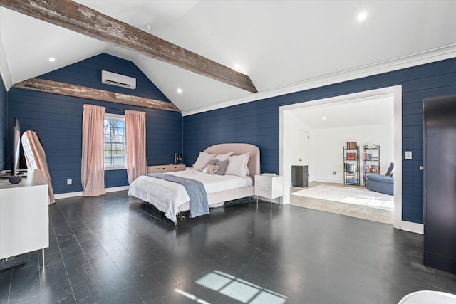 bedroom featuring a wall unit AC, lofted ceiling with beams, wood finished floors, and baseboards