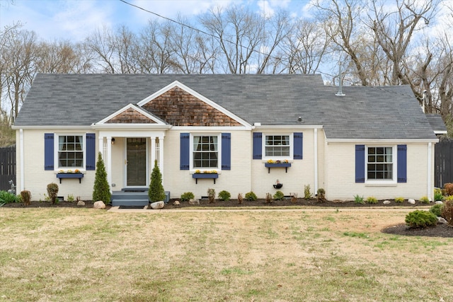 view of front facade featuring a front lawn and brick siding