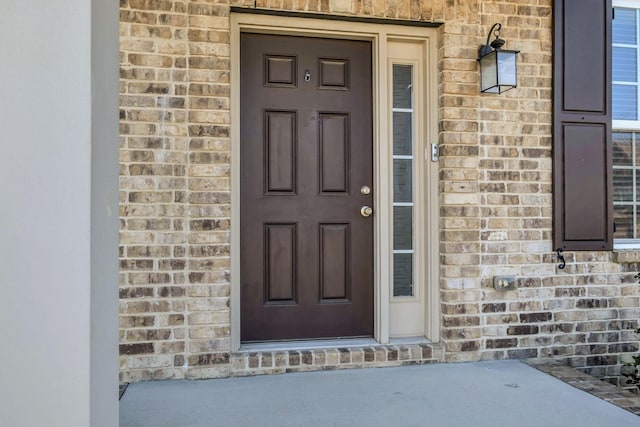 view of exterior entry featuring stone siding