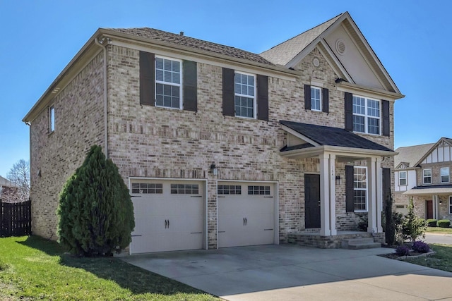 view of front of house with brick siding, concrete driveway, an attached garage, and fence