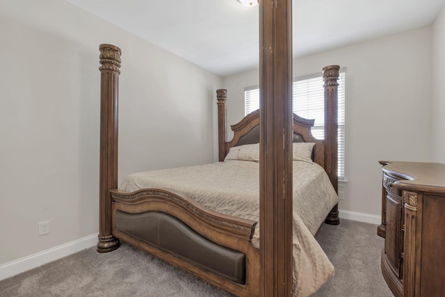 carpeted bedroom with baseboards