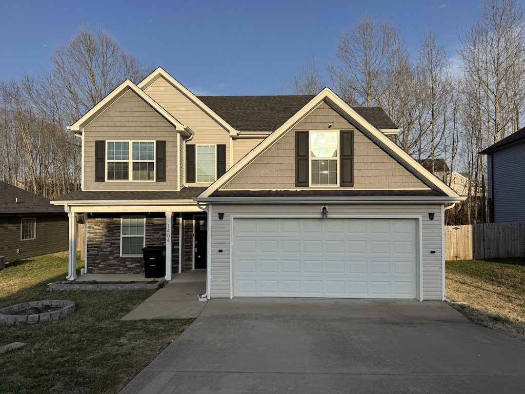 view of front facade featuring fence, covered porch, concrete driveway, a garage, and stone siding