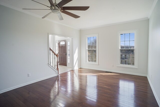 entrance foyer with hardwood / wood-style flooring and crown molding