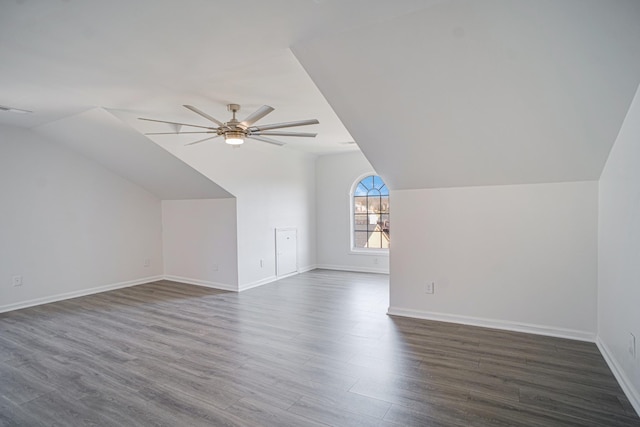 bonus room featuring dark wood finished floors, vaulted ceiling, visible vents, and ceiling fan