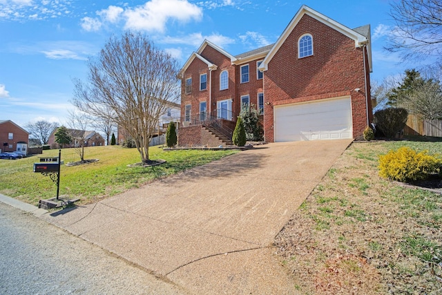 view of front of house with brick siding, a front lawn, concrete driveway, and an attached garage