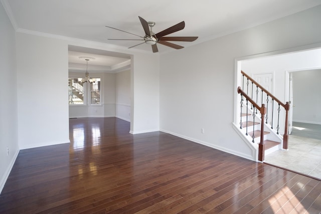 unfurnished room featuring crown molding, baseboards, stairway, ceiling fan with notable chandelier, and wood finished floors