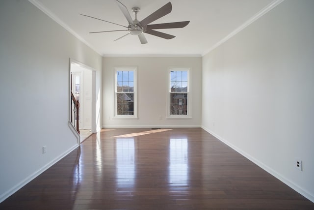 unfurnished room with dark wood finished floors, crown molding, and ceiling fan