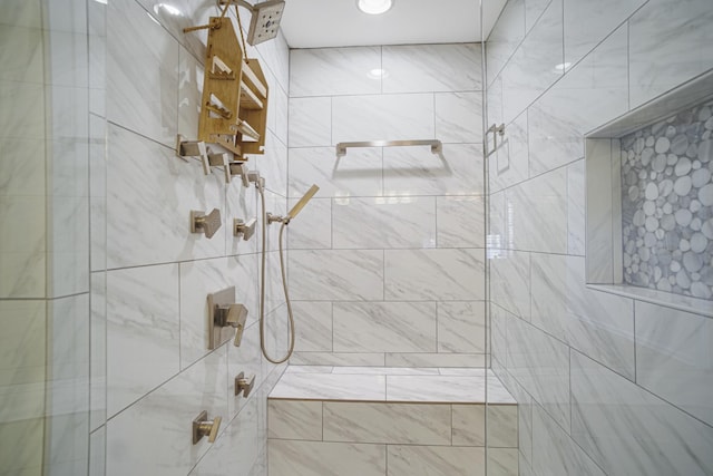 bathroom with a tile shower