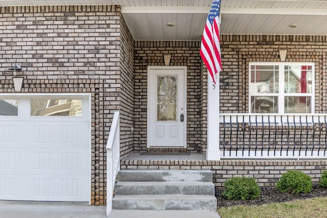 property entrance featuring brick siding