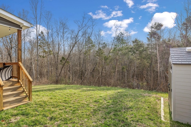 view of yard featuring a wooded view