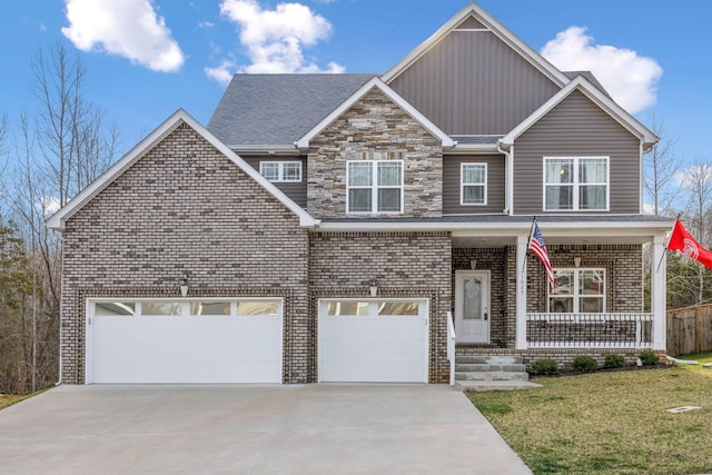 view of front facade featuring a porch, board and batten siding, concrete driveway, a front yard, and a garage