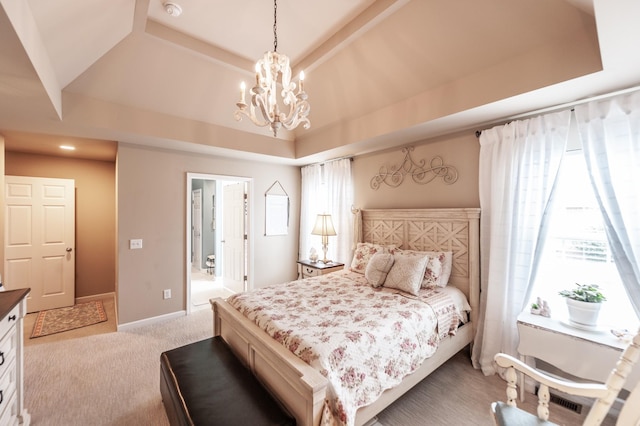 bedroom featuring baseboards, a raised ceiling, carpet, and a chandelier