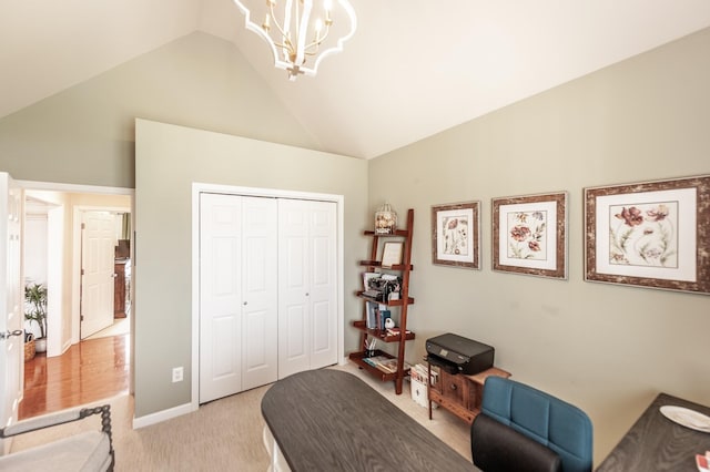 bedroom featuring a closet, a notable chandelier, light colored carpet, and lofted ceiling