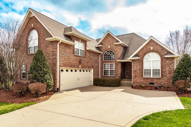 traditional home with an attached garage, brick siding, driveway, and a shingled roof