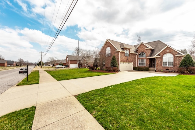 traditional home featuring a front lawn, roof with shingles, concrete driveway, crawl space, and brick siding