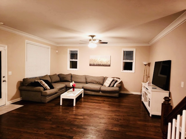 living room featuring dark wood-style floors, ornamental molding, and a ceiling fan