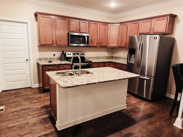 kitchen with light stone counters, appliances with stainless steel finishes, crown molding, and a sink