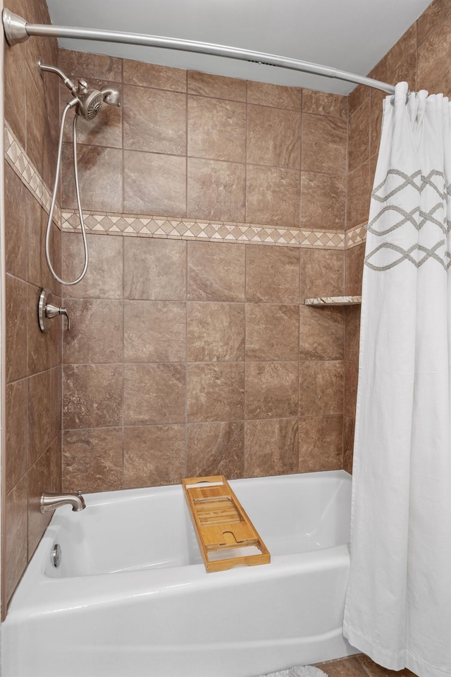 full bathroom featuring shower / tub combo with curtain