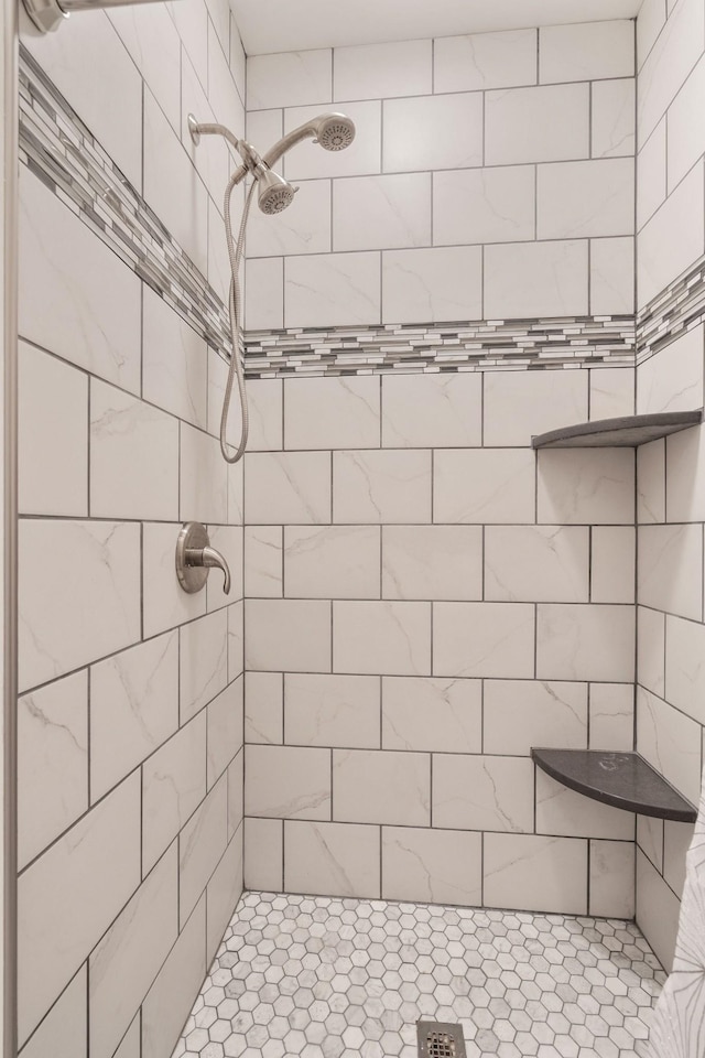 bathroom with tiled shower
