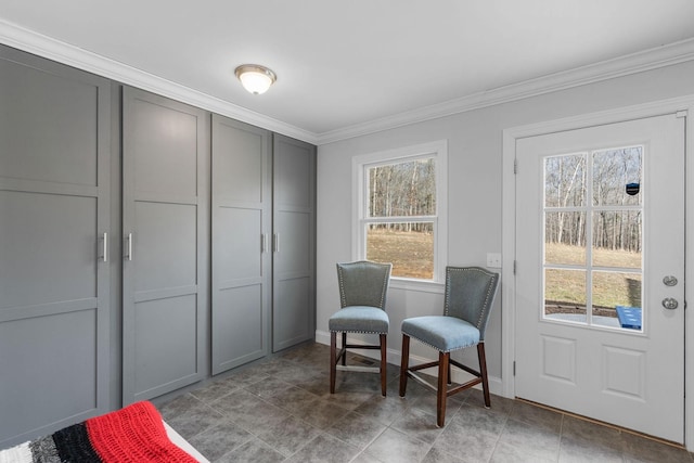 sitting room featuring baseboards and ornamental molding