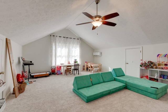 recreation room with carpet flooring, a textured ceiling, lofted ceiling, and ceiling fan