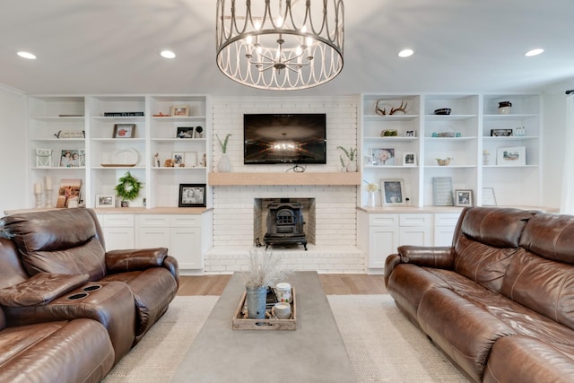 living area featuring recessed lighting, a chandelier, and light wood-style flooring