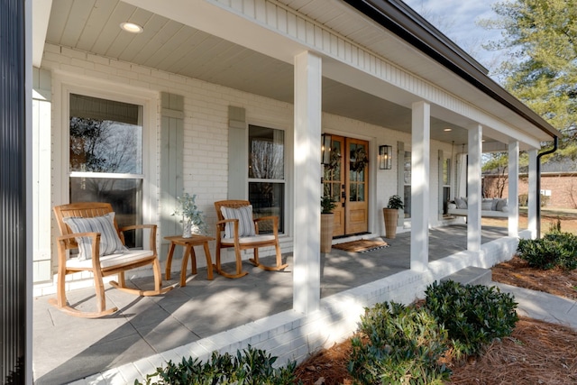 view of patio / terrace featuring french doors and covered porch