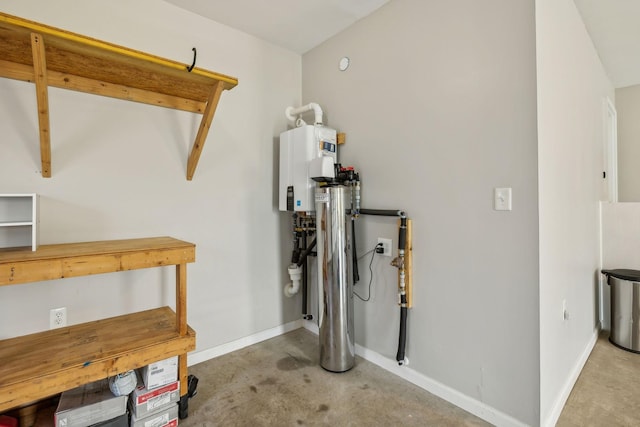 utility room featuring water heater