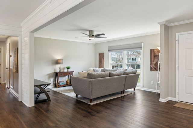 living area featuring ceiling fan, baseboards, dark wood finished floors, and crown molding