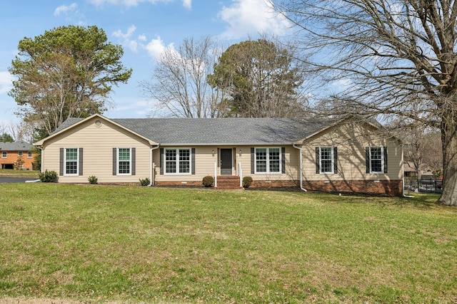 ranch-style home featuring a front yard and a shingled roof