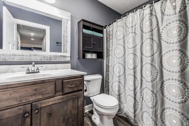 full bathroom with a shower with curtain, toilet, vanity, and a textured ceiling