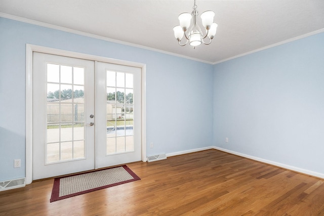 210 Gillen Dr, Sparta, TN 38583 - doorway with an inviting chandelier, ornamental molding, french doors, visible vents, and wood finished floors