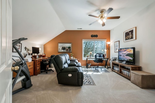 carpeted living area featuring visible vents, lofted ceiling, and ceiling fan