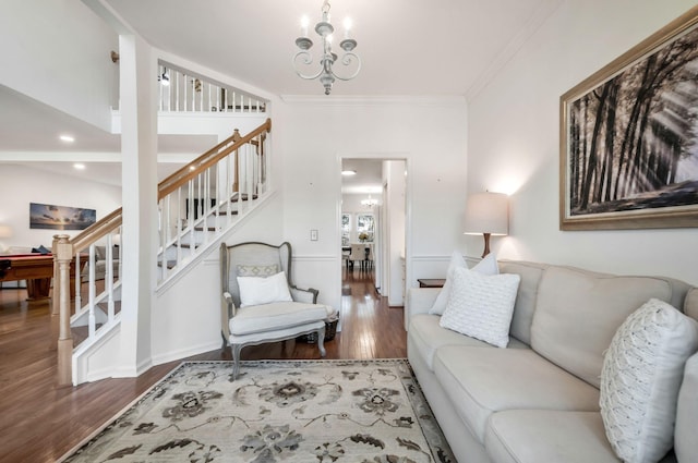 living room featuring crown molding, stairs, recessed lighting, wood finished floors, and a notable chandelier