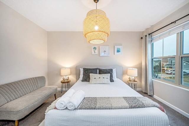 carpeted bedroom with baseboards