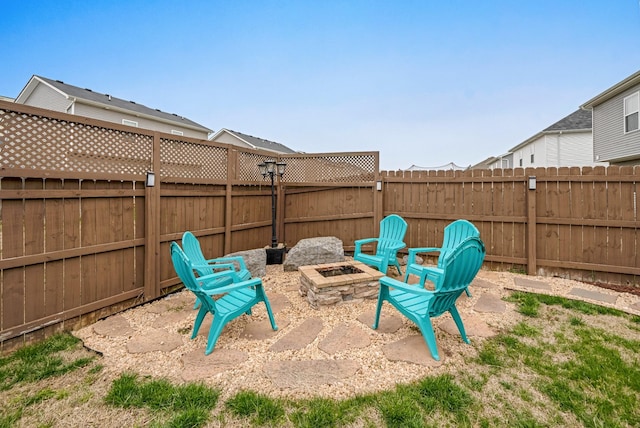 view of patio with a fire pit and a fenced backyard