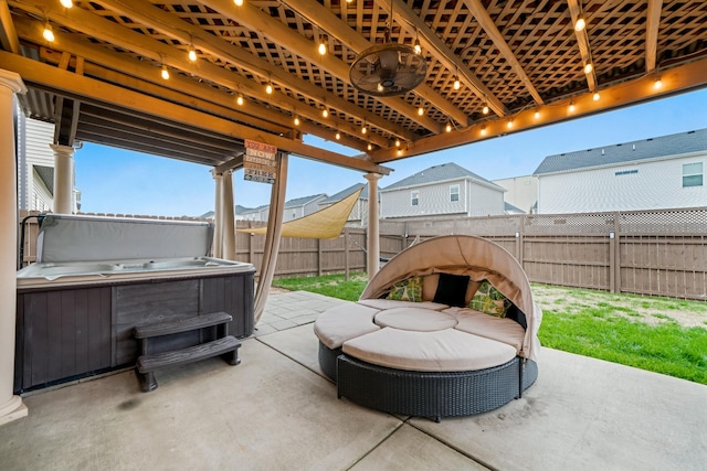 view of patio with a hot tub and a fenced backyard