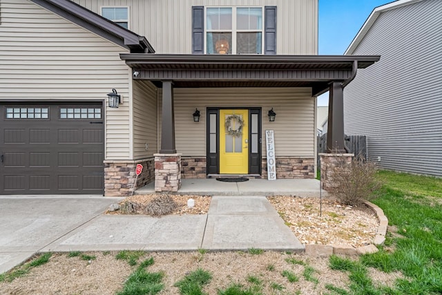 entrance to property featuring board and batten siding, a garage, covered porch, and stone siding