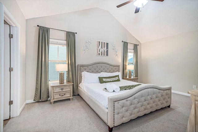 carpeted bedroom featuring baseboards, multiple windows, ceiling fan, and vaulted ceiling