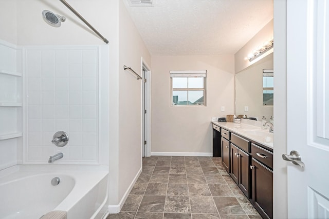 bathroom featuring visible vents, a textured ceiling, vanity, and baseboards