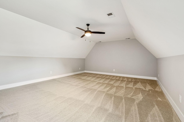 additional living space with ceiling fan, carpet, visible vents, and baseboards