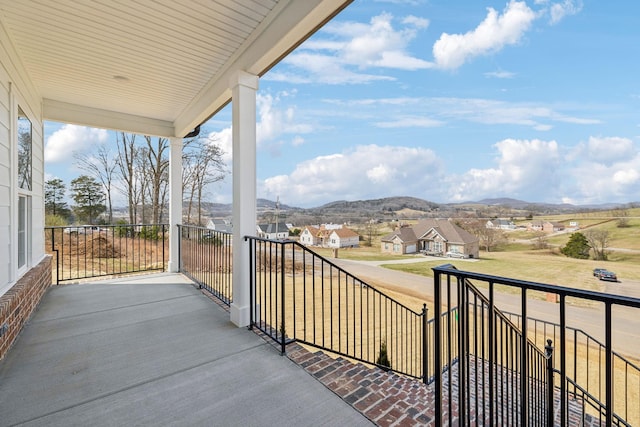 balcony with a mountain view and a residential view