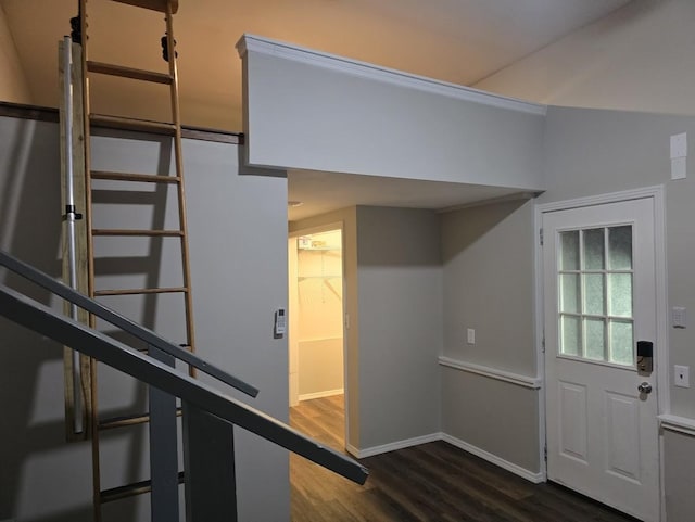 stairway featuring wood finished floors and baseboards