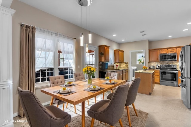 dining room featuring recessed lighting, light tile patterned flooring, and a wealth of natural light