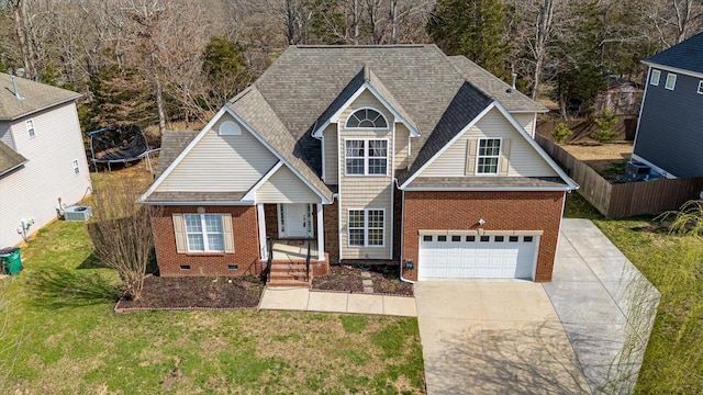 traditional-style home featuring brick siding, a front yard, driveway, and roof with shingles