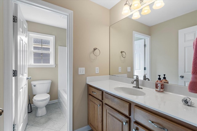 bathroom with vanity, tile patterned flooring, toilet, baseboards, and a notable chandelier