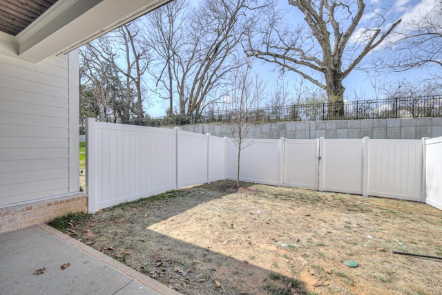 view of yard with a fenced backyard