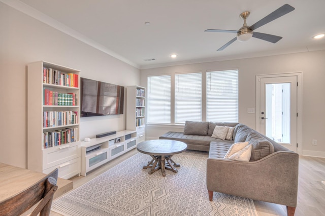 living area featuring visible vents, crown molding, ceiling fan, recessed lighting, and light wood-style flooring