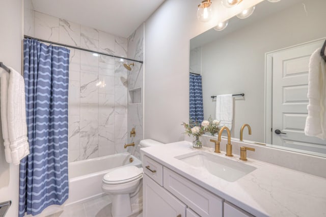 bathroom with vanity, toilet, and shower / bath combo