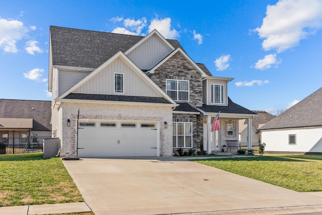 craftsman-style home with board and batten siding, concrete driveway, a front yard, and fence